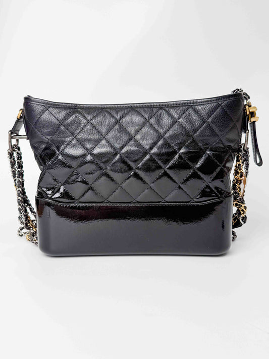 (A125) Chanel Black Patent Goatskin Medium Size Gabrielle Crossbody Bag, Ruthenium/Silver/Gold Hardware