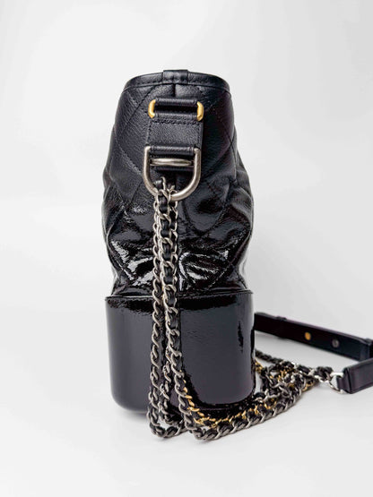 (A125) Chanel Black Patent Goatskin Medium Size Gabrielle Crossbody Bag, Ruthenium/Silver/Gold Hardware