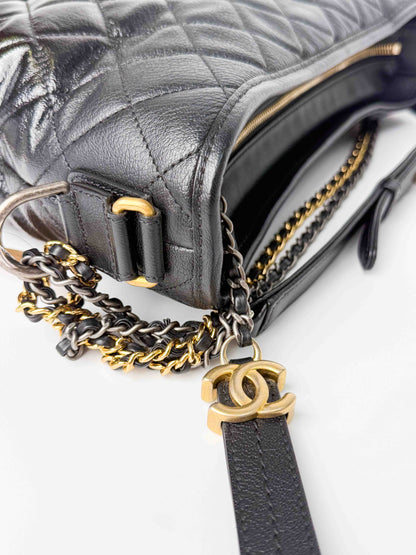 (A125) Chanel Black Patent Goatskin Medium Size Gabrielle Crossbody Bag, Ruthenium/Silver/Gold Hardware