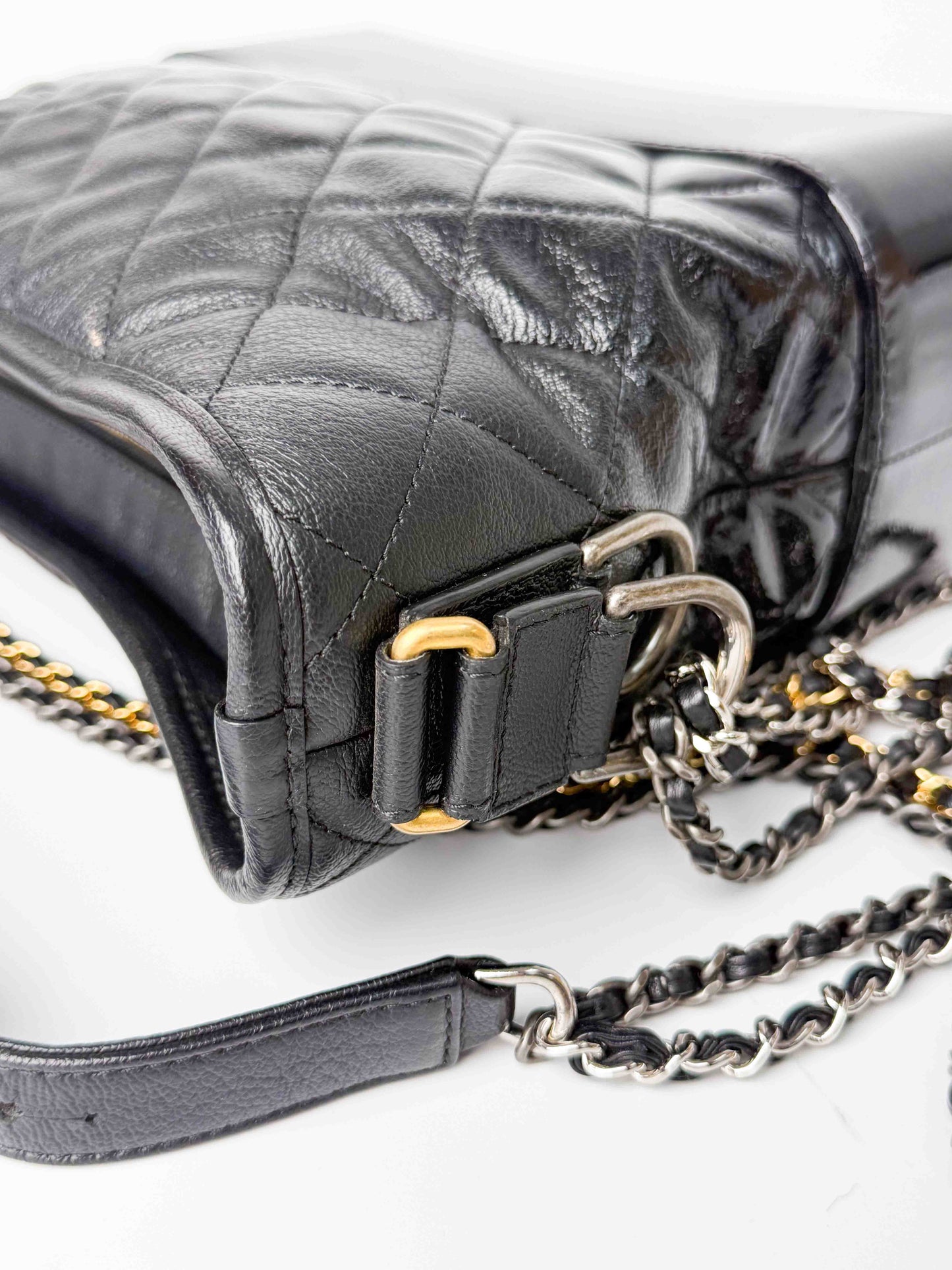 (A125) Chanel Black Patent Goatskin Medium Size Gabrielle Crossbody Bag, Ruthenium/Silver/Gold Hardware